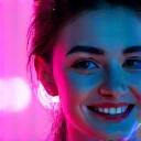 Profile picture of Maya, a young woman with a vibrant, enthusiastic expression against a subtle club background.